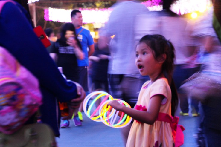 Girl with glow sticks. | Urban Mid-Autumn Lantern Carnival, Victoria Park, Hong Kong | September 27, 2015 | Tanya McGovern