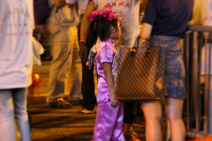 Young performer waits for her turn. | Tai Hang Fire Dragon Dance, Tai Hang, Hong Kong | September 27, 2015 | Tanya McGovern