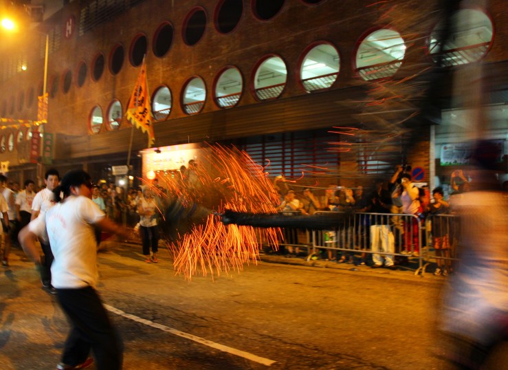 Fire dragon darts through the streets of Tai Hang | Tai Hang Fire Dragon Dance, Tai Hang, Hong Kong | September 27, 2015 | Tanya McGovern