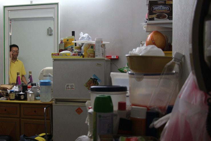 Yu King Hon stands in the flat he has lived in for over 40 years. | Tanya McGovern